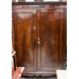 A French style mahogany linen press, possibly altered and reduced in size