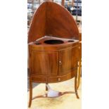 A George III bow fronted gentleman's corner washstand