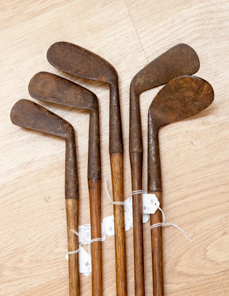 Five vintage iron golf clubs with hickory shafts, one stamped 'Jas. Thomson, St. Andrews Special'