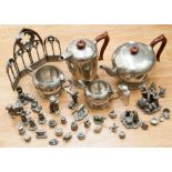 A four piece hand hammered pewter tea set, together with a good quantity of cast pewter figures