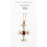 A garnet and pearl cruciform pendant,