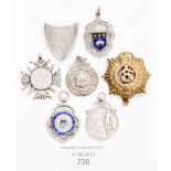 A collection of silver medallions relating to Leeds, sporting, some enamelled,