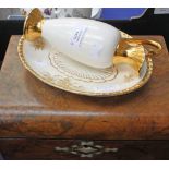 A walnut sewing box, inlaid with mother of pearl, with two Gleneagles Whisky glasses,