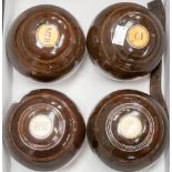 Two pairs of lignum vitae bowling balls,