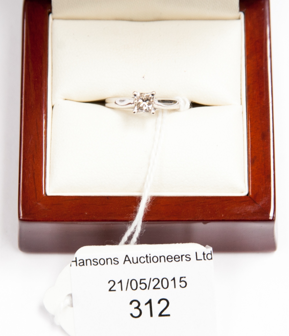 An 18ct gold and diamond solitaire ring, 0.