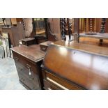 An Art Deco oak bureau together with a Edwardian mirror backed dressing chest.