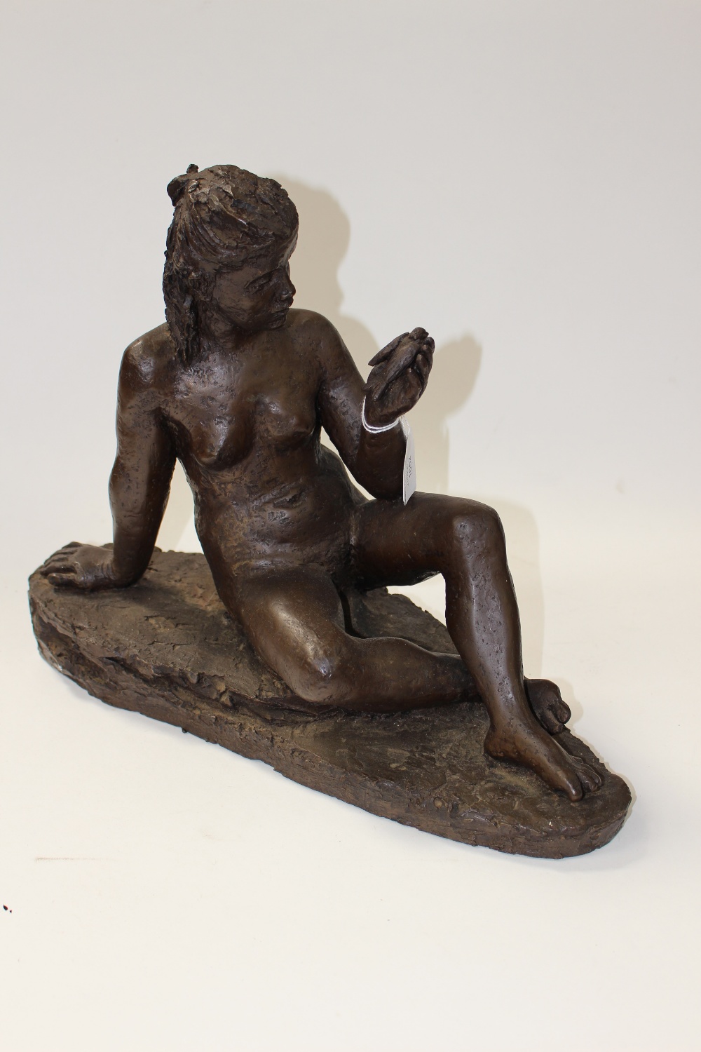 Karin Jonzen RBA (1914-1998), 'Susan in Summer', seated nude holding a bird in her left hand,