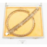 A gilt metal choker link necklace and bracelet pair