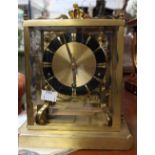 A German Schatz mantle clock, seven jewel movement and eight 'bell' chime in a lacquered brass case,