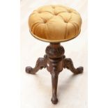 A mid Victorian walnut revolving piano stool