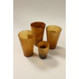 Four 19th Century horn beakers of conical tapering form, three measuring approx 10 cms,