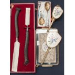 A boxed horn handled carving set, pair of boxed berry spoons,