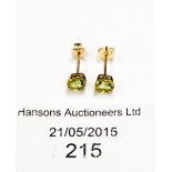 A pair of 9ct gold and peridot stud earrings