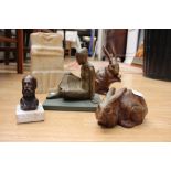 A collection of sculptures, including cast rabbits,