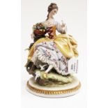 A Continental porcelain figure of a lady with doves
