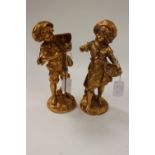 A pair of French 19th Century spelter (re gilded) girl and boy figures, signed August.