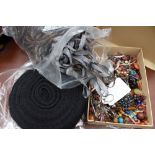 A quantity of beads and a roll of black lace etc