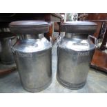 **TO BE SOLD BT PRIVATE TREATY**
A pair of leather upholstered steel milk churns,