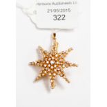 A diamond and yellow metal star brooch/pendant, stamped 750,