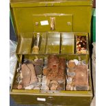 Green metal cash box of mixed coins