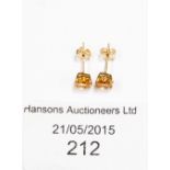 A pair of 9ct gold and citrine studs