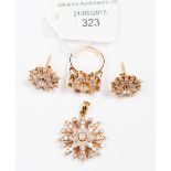 A diamond cluster and yellow metal (probably 18ct gold) earring,