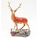 A Beswick Stag on rocky outcrop