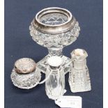 Four cut glass dressing table pieces, three with silver tops,