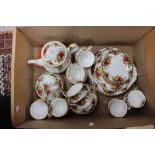 A Royal Albert Country Roses tea service with teapot and extras one box including calendars plates