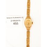 A 9ct gold ladies wristwatch Tissot circa 1973 on bark effect bracelet