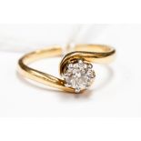 A solitaire diamond ring,