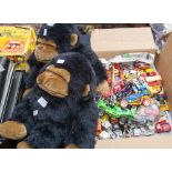 A box of modern diecast vehicles and two cuddly monkeys