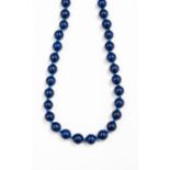 A Lapis Lazuli single strand bead necklace, with approximately 36 round 10mm beads,