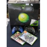 A boxed X Box game system with contents 2002 issue