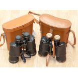 Two pairs of binoculars in cases,