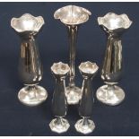 A collection of silver vases, including Birmingham 1913, 1910 and 1908,