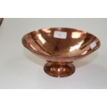 An arts and crafts style copper pedestal bowl with hammered finish 19½cm diameter approx