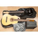 An Encore (John Hornby) black six string electric guitar and an East German acoustic guitar,