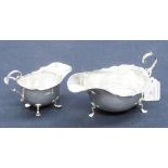 A silver sauceboat and silver cream jug, with Chester and Birmingham hallmarks,
