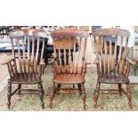 A pair of 19th century Windsor beech and elm saddle seated armchairs,