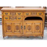 A Victorian Aesthetic oak sideboard, fitted with threes drawers over two doors, carved,
