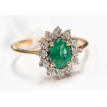 An 18ct gold emerald and diamond ring