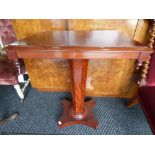 A mid Victorian pedestal side table, the rectangular top with moulded edge,