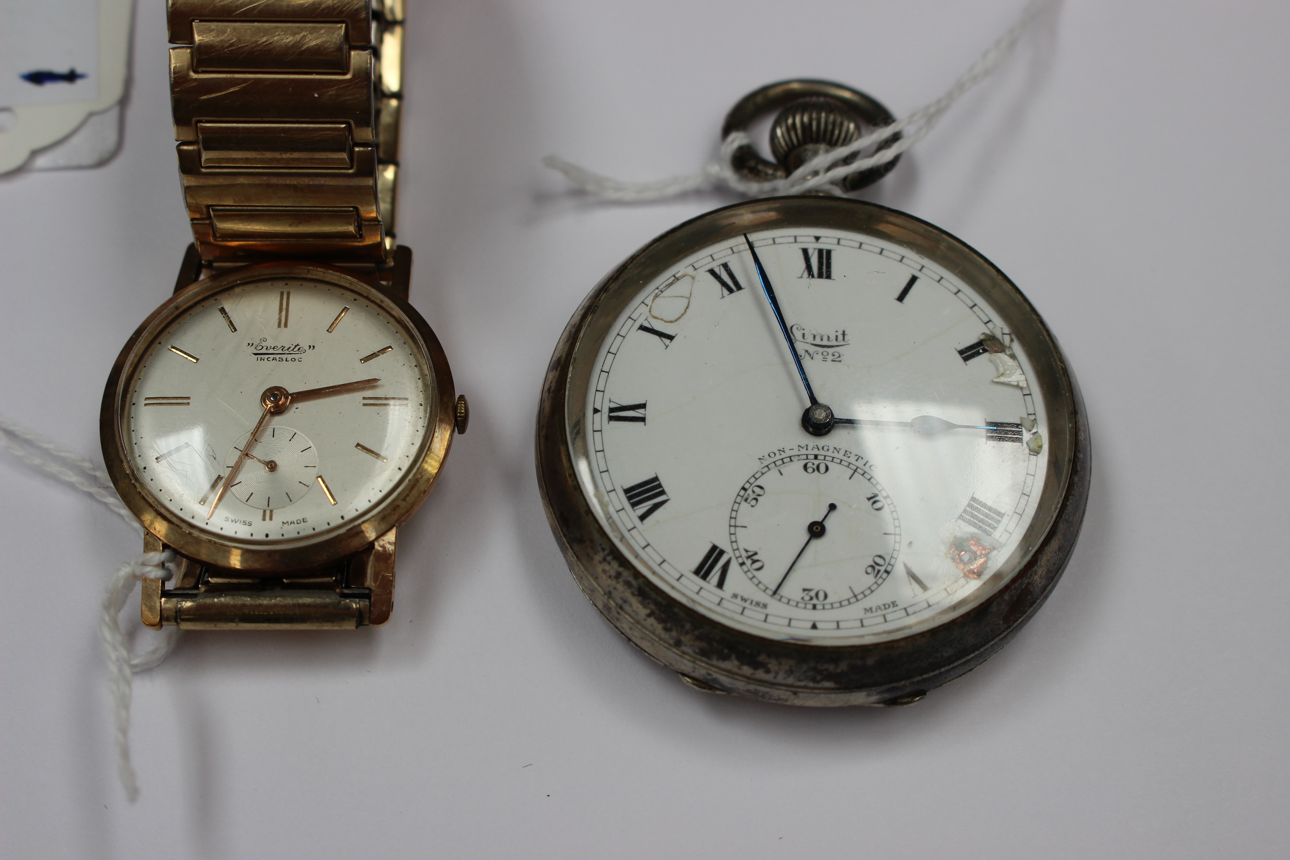 **NEW GUIDE**A 1950s Everite watch 9ct gold case on expanding bracelet and a white metal 'Limit'