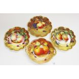 Three Coalport fruit painted cabinet plates and a basket, signed M.Harnett, J.Mottram, R.Budd and P.