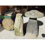 A pair of 19th century stone saddle stones, one AF with a detached top,