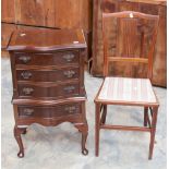 An early 20th Century walnut veneered serpentine chest on stand, three drawers over one,