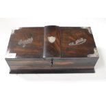 A rosewood cigarette box with silver corner mounts and silver circular trays contained inside,