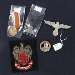 Assorted metal and cloth badges