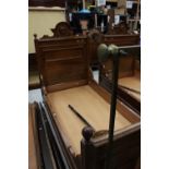 A pair of 19th century French style walnut beds, with panelled headboards,